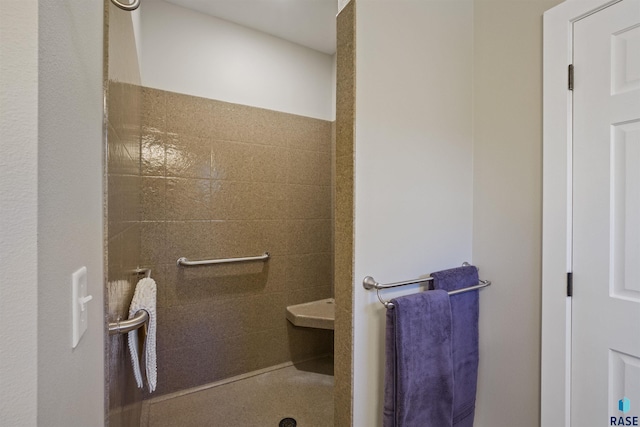 bathroom with tiled shower