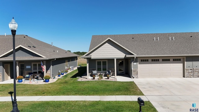 exterior space featuring a garage and a front yard