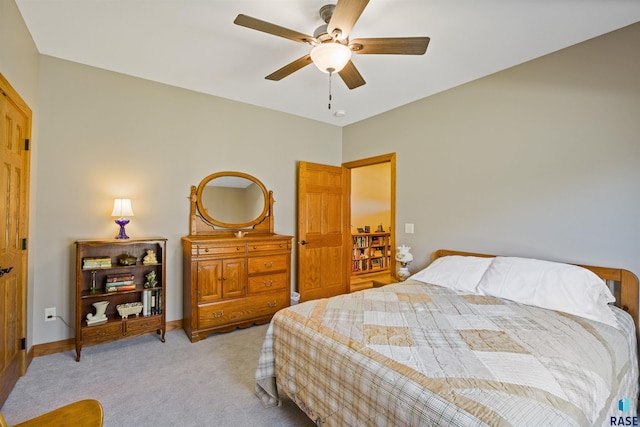 bedroom with ceiling fan and light colored carpet