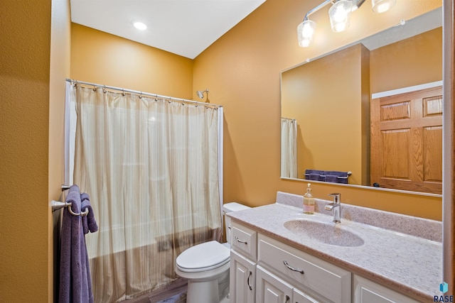 full bathroom featuring toilet, shower / bath combination with curtain, and vanity