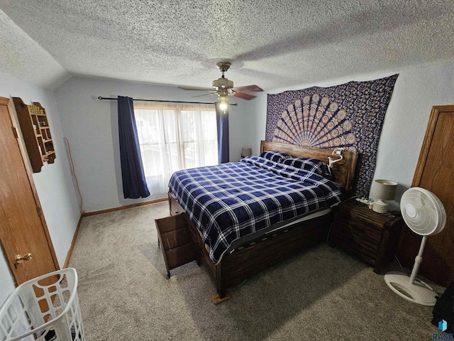 carpeted bedroom featuring ceiling fan, vaulted ceiling, and a textured ceiling