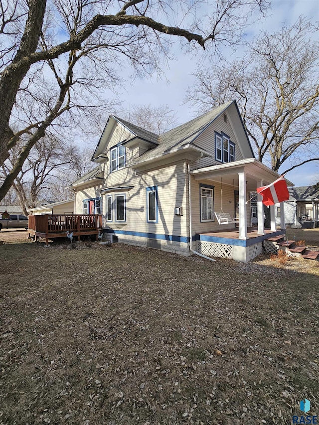 view of side of home featuring a porch