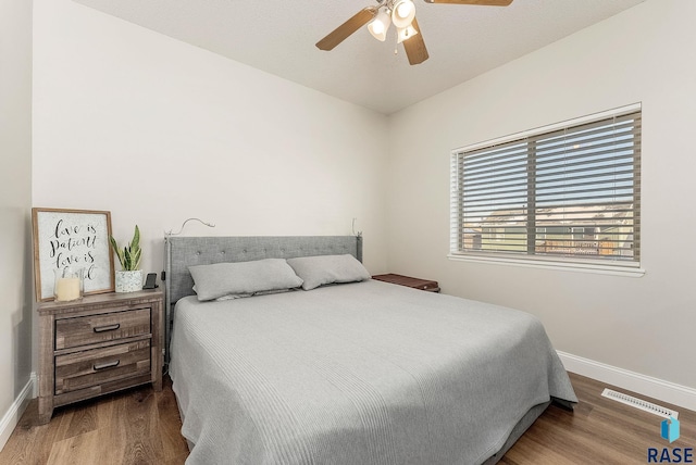 bedroom featuring ceiling fan and hardwood / wood-style floors