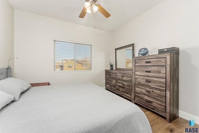 bedroom featuring light wood-type flooring and ceiling fan