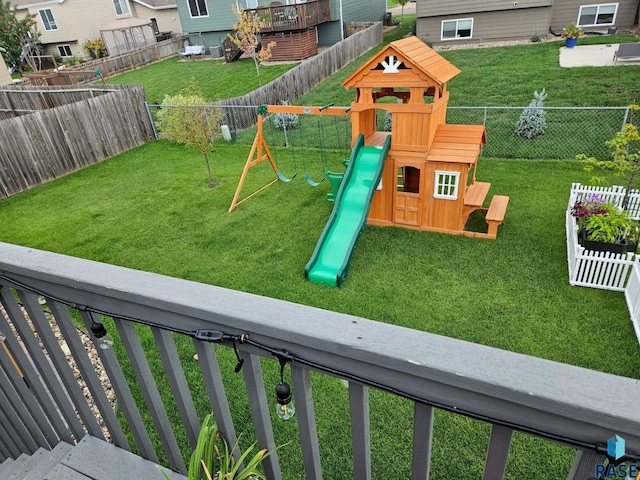 view of jungle gym featuring a lawn