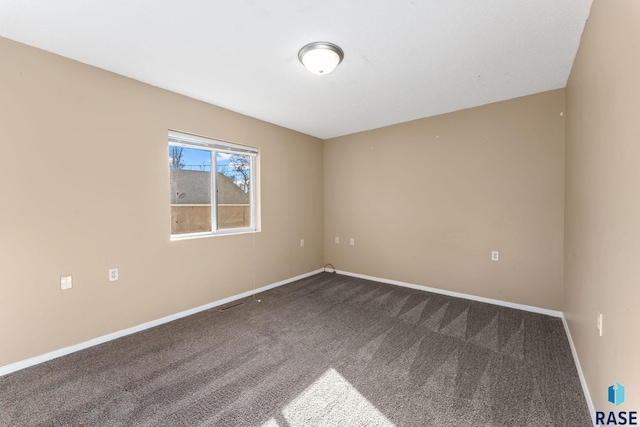 unfurnished room featuring carpet