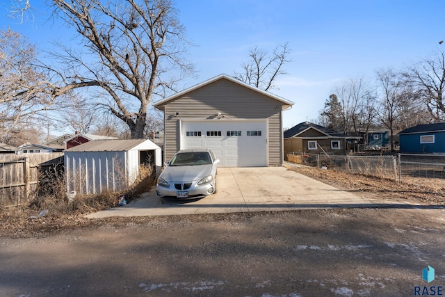 view of front of home with an outdoor structure and a garage