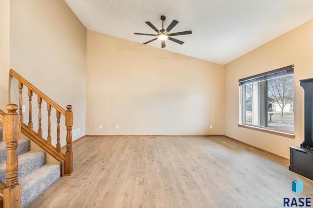 unfurnished living room featuring ceiling fan and light hardwood / wood-style flooring