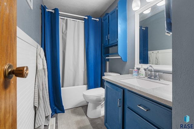 full bathroom with vanity, shower / tub combo, tile patterned floors, and toilet