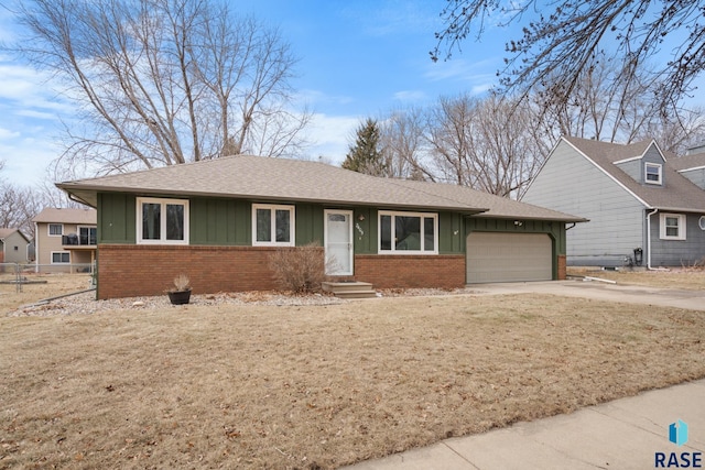 view of front of home with a garage and a front yard