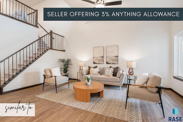 living room featuring ceiling fan and wood-type flooring