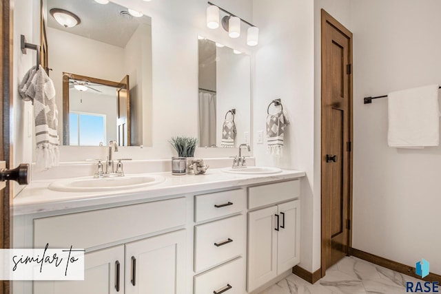 bathroom featuring ceiling fan and vanity