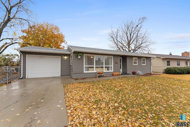 ranch-style house featuring a garage