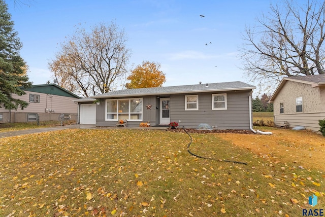 single story home with a front lawn and a garage