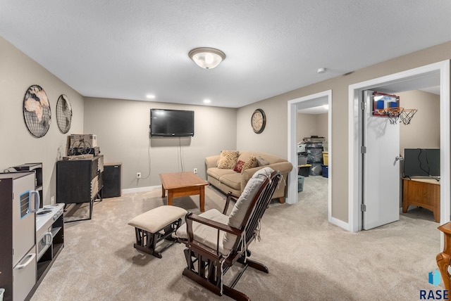 carpeted living room featuring a textured ceiling