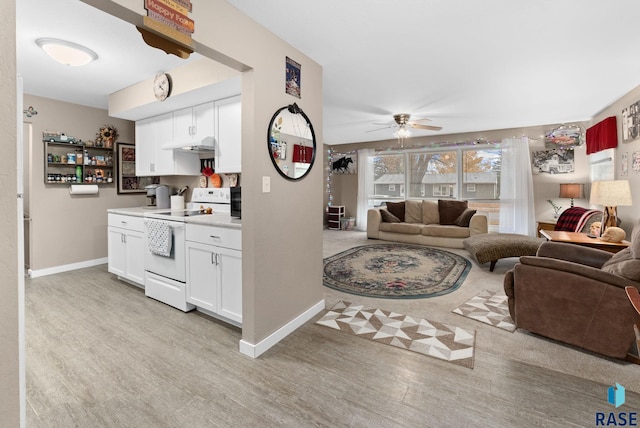 living room with ceiling fan and light wood-type flooring