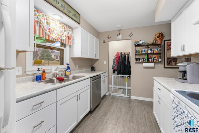 kitchen with light hardwood / wood-style floors, sink, white cabinets, and dishwasher