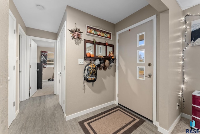 entryway with light hardwood / wood-style floors