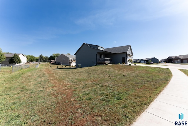 view of home's exterior with a yard