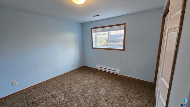 empty room featuring carpet floors and a baseboard radiator