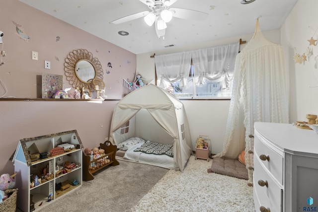 bedroom with ceiling fan and light colored carpet