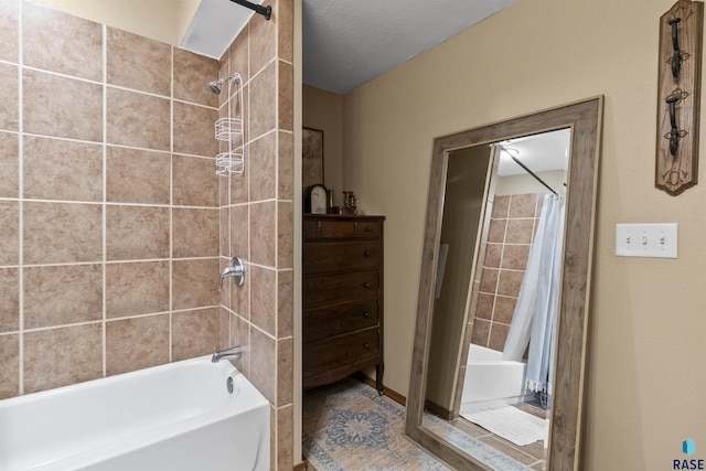 bathroom featuring shower / bath combo with shower curtain and a textured ceiling