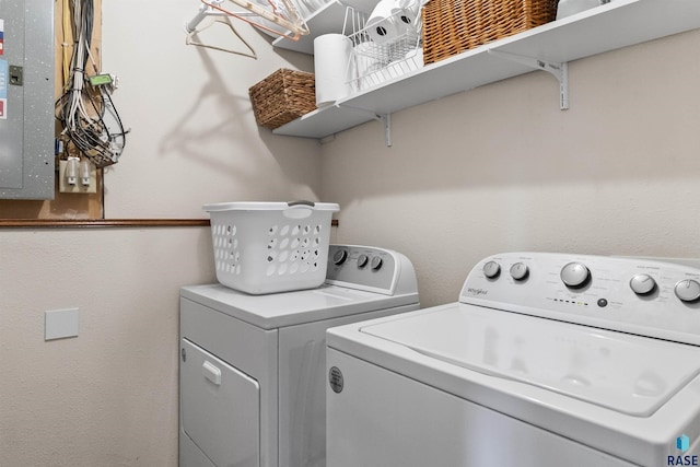 washroom with electric panel and independent washer and dryer