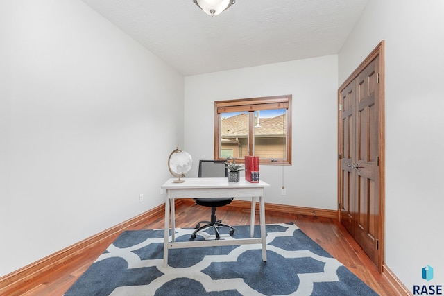 home office featuring hardwood / wood-style flooring