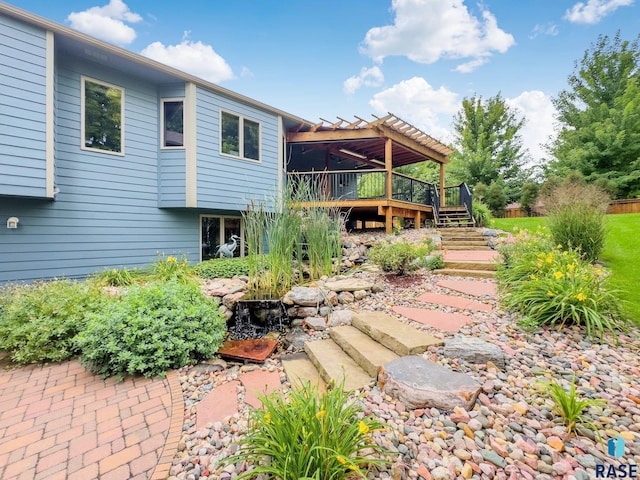 back of property featuring a wooden deck