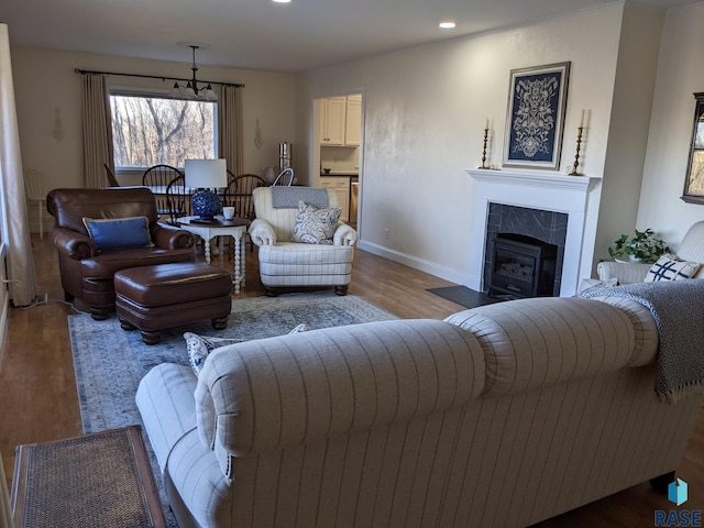 living room featuring a fireplace and light hardwood / wood-style flooring