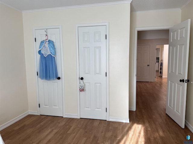 entrance foyer featuring dark hardwood / wood-style flooring and ornamental molding