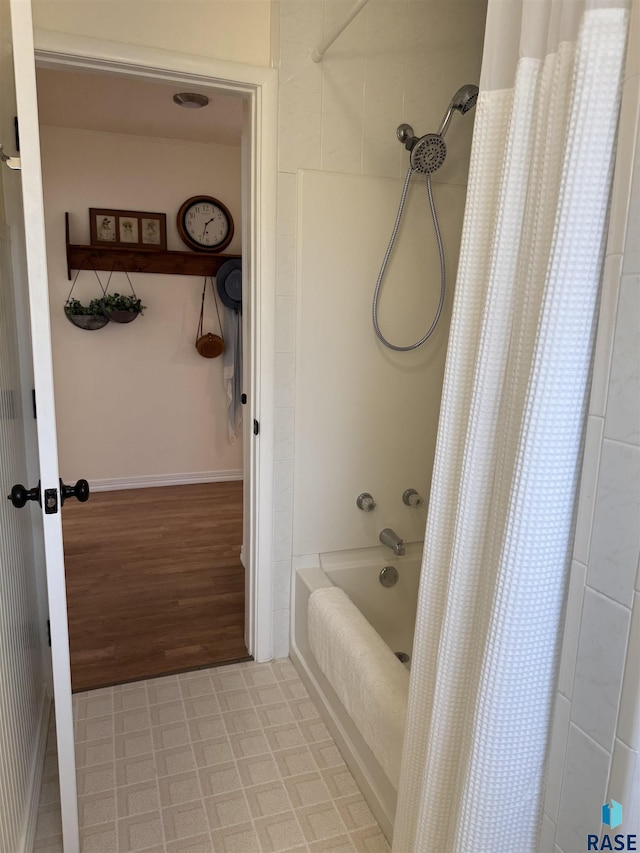 bathroom with shower / bath combination with curtain and hardwood / wood-style flooring