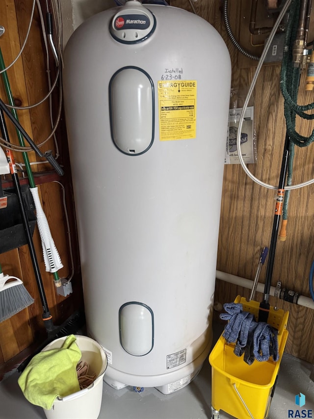 utility room with water heater