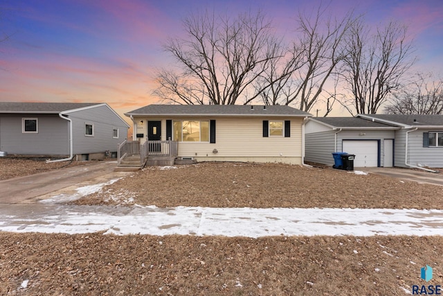 single story home featuring a garage