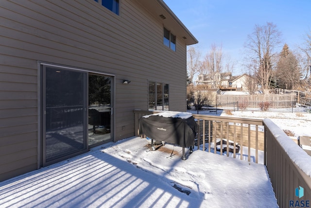 snow covered deck with area for grilling