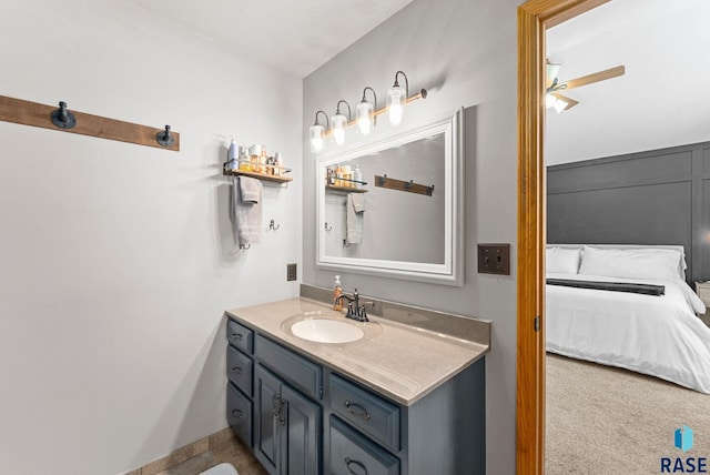 bathroom with ceiling fan and vanity