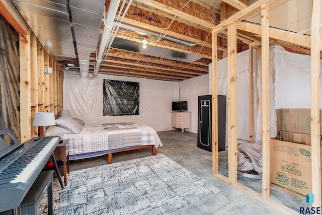 bedroom featuring concrete flooring