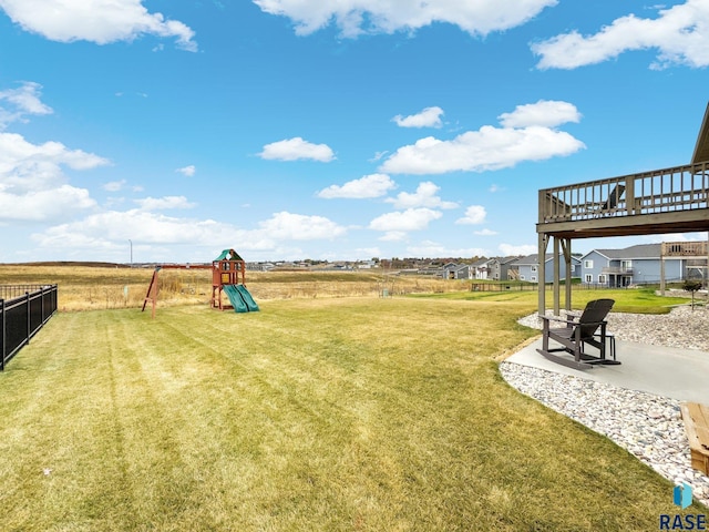 view of yard featuring a patio area and a playground