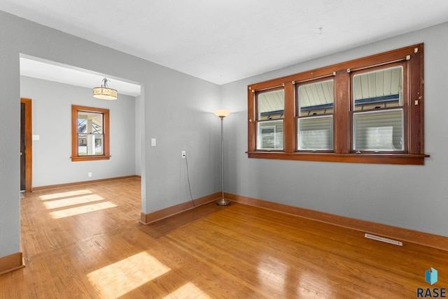 unfurnished room featuring light wood-type flooring