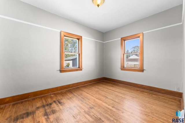 unfurnished room featuring wood-type flooring