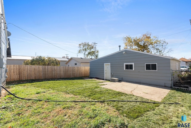 rear view of house with a lawn and a patio area