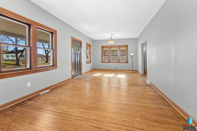 spare room featuring light hardwood / wood-style flooring