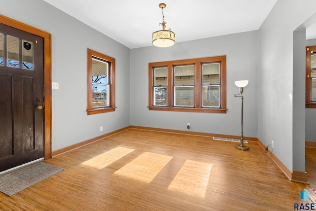 foyer with light hardwood / wood-style floors