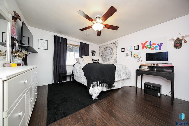 bedroom featuring ceiling fan and dark hardwood / wood-style floors