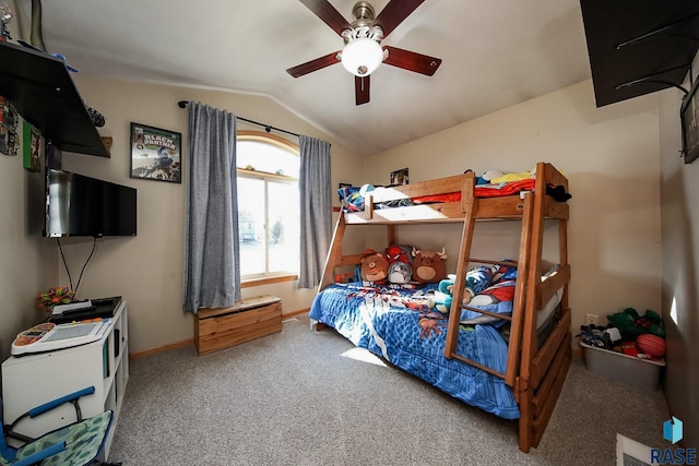 bedroom with ceiling fan, carpet, and lofted ceiling