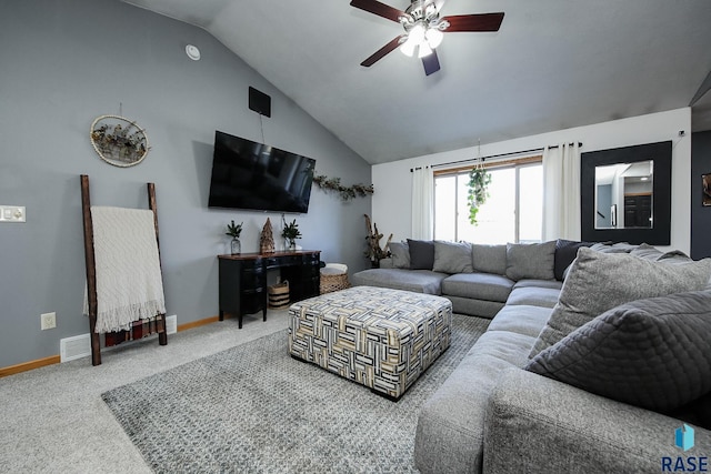 living room with carpet floors, ceiling fan, and vaulted ceiling