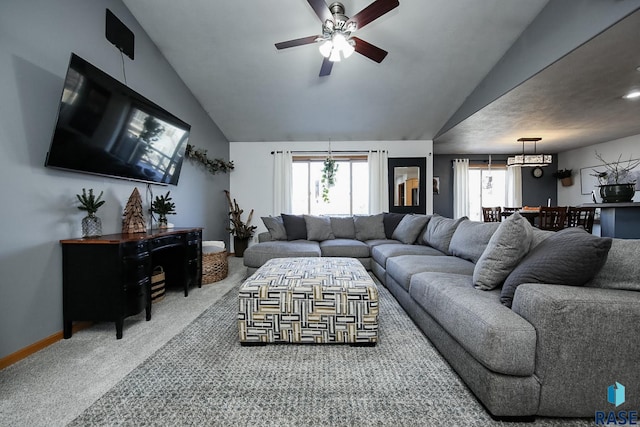 living room with ceiling fan, baseboards, vaulted ceiling, and carpet flooring