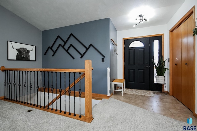 entrance foyer featuring tile patterned floors