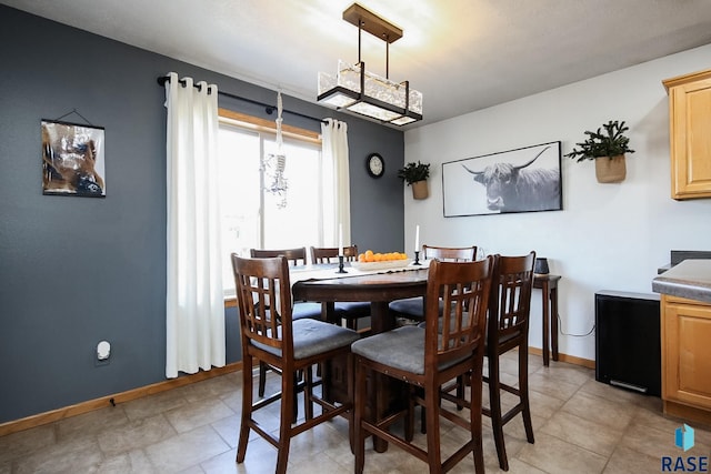 dining room featuring baseboards