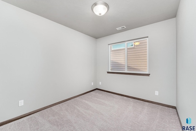 unfurnished room with carpet floors